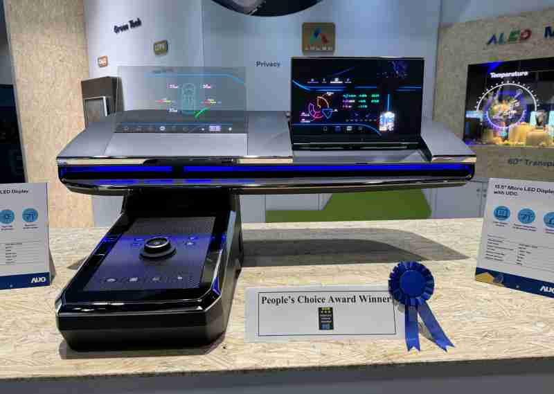 28国际车用Micro LED Display HMI解决方案获”最佳车用显示奖”，，以用户为中心开发，，针对前座驾驶与乘客设计兼具娱乐与安全的高画质屏幕，，包含车舱前座的Micro LED透明屏幕及全球首款内建镜头的智慧Micro LED显示器